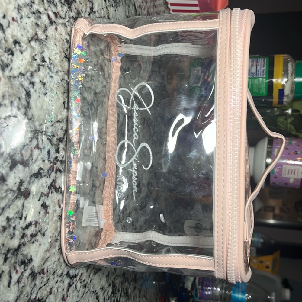 A jessica simpson bag you can use for makeup or small things